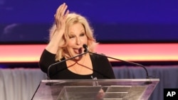 FILE - Bette Midler speaks at 15th Annual Movies for Grownups Awards at the Beverly Wilshire Hotel, Feb. 8, 2016, in Beverly Hills, California. Along with Cate Blanchett and Sally Field, Midler received a best actress nomination in Broadway's Tony Awards Tuesday.