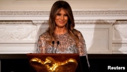 FILE - U.S. first lady Melania Trump speaks as she and President Donald Trump host the White House Historical Association reception and dinner at the White House in Washington, Sept. 14, 2017.