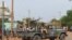 FILE—Malian soldiers ride on a pick-up truck with a machine gun after a suicide car bomb attack overnight by the GSIM jihadist group in Gao, November 13, 2018.