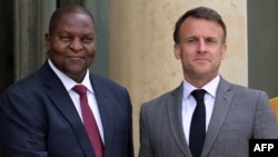 FILE—France's President Emmanuel Macron (R) poses with President of Central African Republic Faustin-Archange Touadera (L) prior to a working lunch at the presidential Elysee Palace in Paris on April 17, 2024.