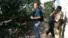 VOA's Peter Heinlein investigates wreckage from the "Black Hawk Down" incident near Mogadishu, Somalia, Aug. 13, 2011. (VOA Photo/G. Joselow)