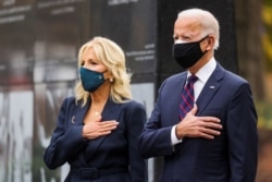 President-elect Joe Biden, accompanied by his wife Jill, attends a Veterans Day observance in Philadelphia, Pennsylvania, Nov. 11, 2020.