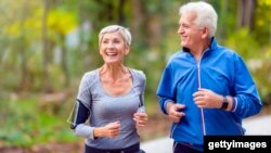 An older couple couple jogging in the park. (Getty Images)