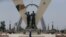 FILE - A man walks past "Place de la Nation" park in N'Djamena, Chad, April 26, 2021.