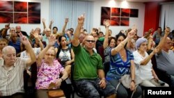 FILE - Neighborhood residents vote during the nominations for candidates for municipal assemblies in Havana, Cuba, Oct. 12, 2017. 