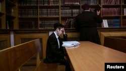 A Jewish boy prays at a synagogue in Donetsk, eastern Ukraine, April 20, 2014.