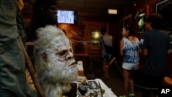 A Bigfoot mask and other items donated by the family of Yeti researcher Tom Slick on display at Expedition: Bigfoot! The Sasquatch Museum in Cherry Log, Georgia, Aug. 8, 2019.