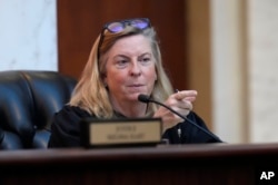 FILE - Colorado Supreme Court Justice Maria E. Berkenkotter questions an attorney during a hearing before the court on December 6, 2023, in Denver, Colorado.