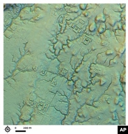 This LIDAR image provided by researchers shows a main street crossing an urban area, creating an axis along which complexes of rectangular platforms are arranged around low squares at the Copueno site, Upano Valley in Ecuador. (Antoine Dorison, Stéphen Rostain via AP)