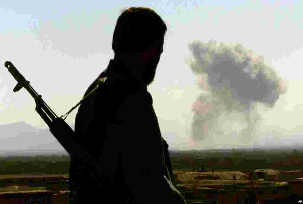 November 13, 2001 -- Northern Alliance and U.S. forces enter the Afghan capital, Kabul, forcing the Taliban to retreat and flee south toward Kandahar province.