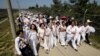 U.S. activist Gloria Steinem, seventh from right, two Nobel Peace Prize laureates and other activists march to the Imjingak Pavilion along the military wire fences near the border village of Panmunjom in Paju, north of Seoul, South Korea, May 24, 2015.