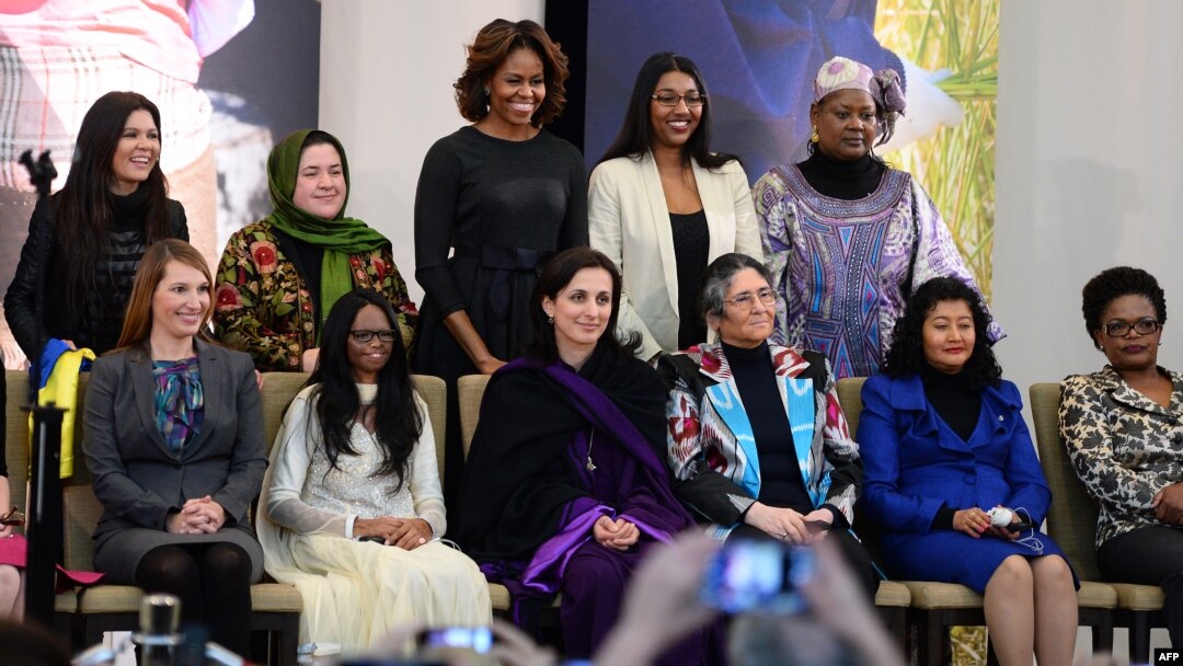 First Lady Michelle Obama, back row, center, poses with recipients of the Secretary of State’s International Women of Courage Award, Washington, March 4, 2014.