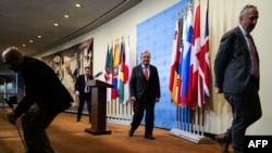 U.N. Secretary-General Antonio Guterres, center, leaves after speaking to the media at United Nations headquarters in New York on April 5, 2024, ahead of the six-month mark of the Israel-Hamas war.