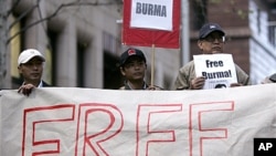 Activists hold "Free Burma" placards at a protest in Sydney in support of marches in Rangoon by Buddhist monks, (File).