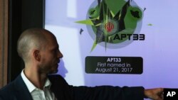 Alister Shepherd, the director of a subsidiary of the cybersecurity firm FireEye, gestures during a presentation about the APT33 hacking group, which his firm suspects are Iranian government-aligned hackers, in Dubai, United Arab Emirates, Sept. 18, 2018.