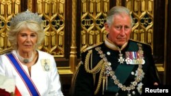 FILE PHOTO: Britain's Prince Charles and Camilla, Duchess of Cornwall, wait for Queen Elizabeth to deliver her speech during the State Opening of Parliament in London