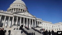 The U.S. flag flies at half-staff at the Capitol during the funeral of former President Jimmy Carter on Jan. 9, 2025. Mike Johnson, speaker of the House of Representatives, on Jan. 14 ordered flags at the Capitol to be flown at full height on Inauguration Day.