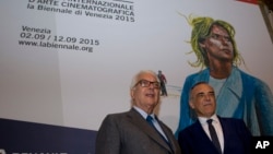 Venice Biennale President Paolo Baratta and Italian Festival Director Alberto Barbera, right, pose prior to a press conference to present the Venice Film Festival, in Rome, July 29, 2015. 