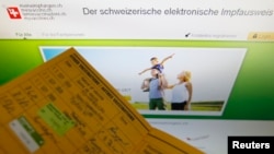 FILE - An illustration picture shows the main page of the Swiss electronic vaccination record website (meineimpfungen.ch) in Bern, April 22, 2013.