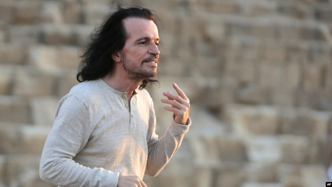 Greek musician Yiannis Hrysomallis, who goes by the stage name Yanni, poses during his visit to the Giza Pyramids, just outside Cairo, Egypt, Oct. 28, 2015.