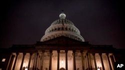 FILE - The Dome of the U.S. Capitol is visible in the early morning hours, in Washington, Dec. 9, 2019.