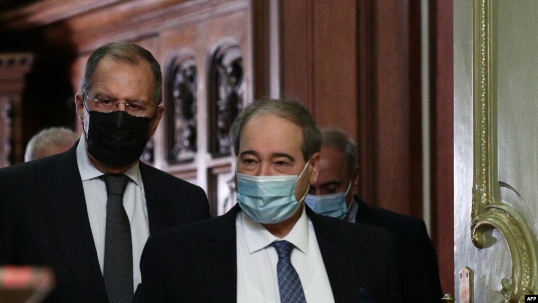 Menteri Luar Negeri Rusia Sergei Lavrov dan Menteri Luar Negeri Suriah Faisal Mekdad di Moskow, Rusia, 17 Desember 2020. (Foto: Handout /Kementerian Luar Negeri Rusia/ AFP)