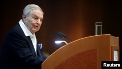 FILE - Billionaire investor George Soros speaks to the audience at the Schumpeter Award in Vienna, Austria, June 21, 2019. 