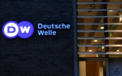 FILE - The logo of German international broadcaster Deutsche Welle is pictured in Berlin, Germany, Jan. 30, 2020.