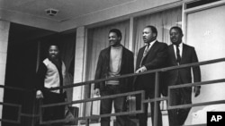 FILE - In this Apr. 3, 1968 file photo, the Rev. Martin Luther King Jr. stands with other civil rights leaders on the balcony of the Lorraine Motel in Memphis, Tenn., a day before he was assassinated at approximately the same place. From left are Hosea Williams, Jesse Jackson, King, and Ralph Abernathy. 