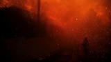 A firefighter stands among flying sparks as the Eaton Fire burns in Pasadena, California, Jan. 7, 2025. 