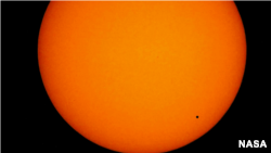 Mercury will transit the Sun Monday and will appear as a small black dot. 