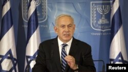 Israel's Prime Minister Benjamin Netanyahu gestures as he delivers a statement to the foreign media in Tel Aviv, November 15, 2012.