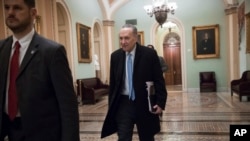 Senate Minority Leader Chuck Schumer, D-N.Y., arrives at the Capitol at the start of the third day of the government shutdown, in Washington, Monday, Jan. 22, 2018. 