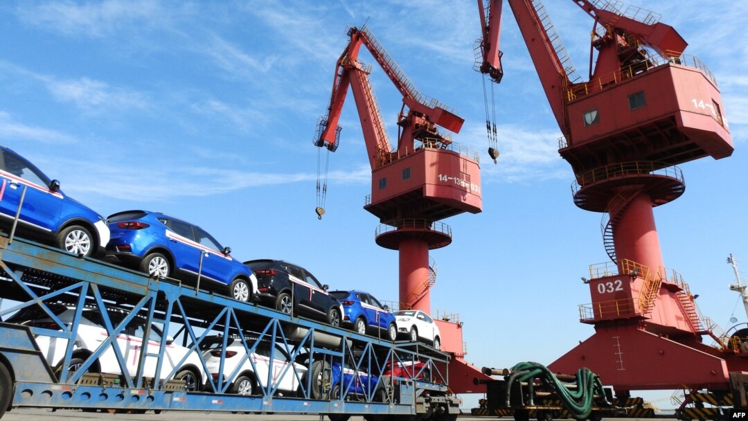 FILE - Cars to be exported are seen at a port in Lianyungang in China's eastern Jiangsu province on May 31, 2018.