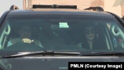 A man walks under trees covered with hoar-frost on Galyateto Mountain, Hungary.