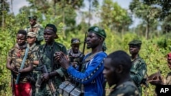 FIKLE: Armed militiamen gather near Rutshuru, 70 kms north of Goma, Democratic Republic of Congo,Wednesday June 22, 2022. East Africa's leaders have responded to the threat of war between Rwanda and Congo by instructing a new regional force to deploy in eastern Congo 
