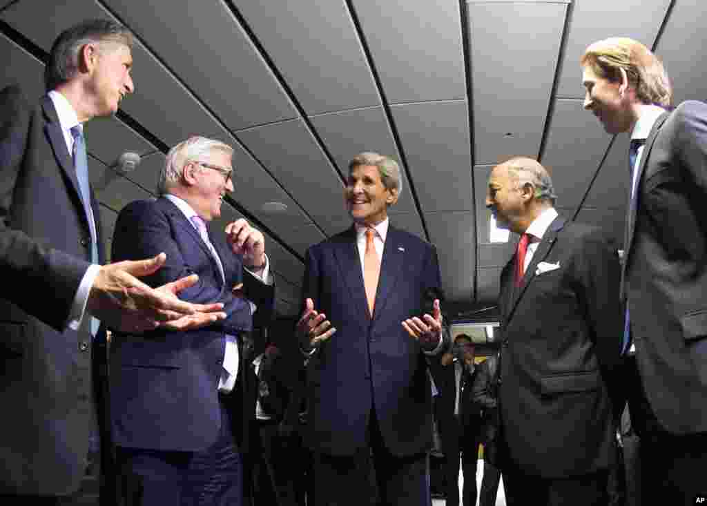 French Foreign Minister Laurent Fabius (2nd right), German Foreign Minister Frank-Walter Steinmeier (2nd left), British Foreign Secretary Philip Hammond (left), U.S. Secretary of State John Kerry (center), and Austrian Foreign Minister Sebastian Kurz (right) talk prior to their final plenary meeting at the United Nations building in Vienna, Austria July 14, 2015.