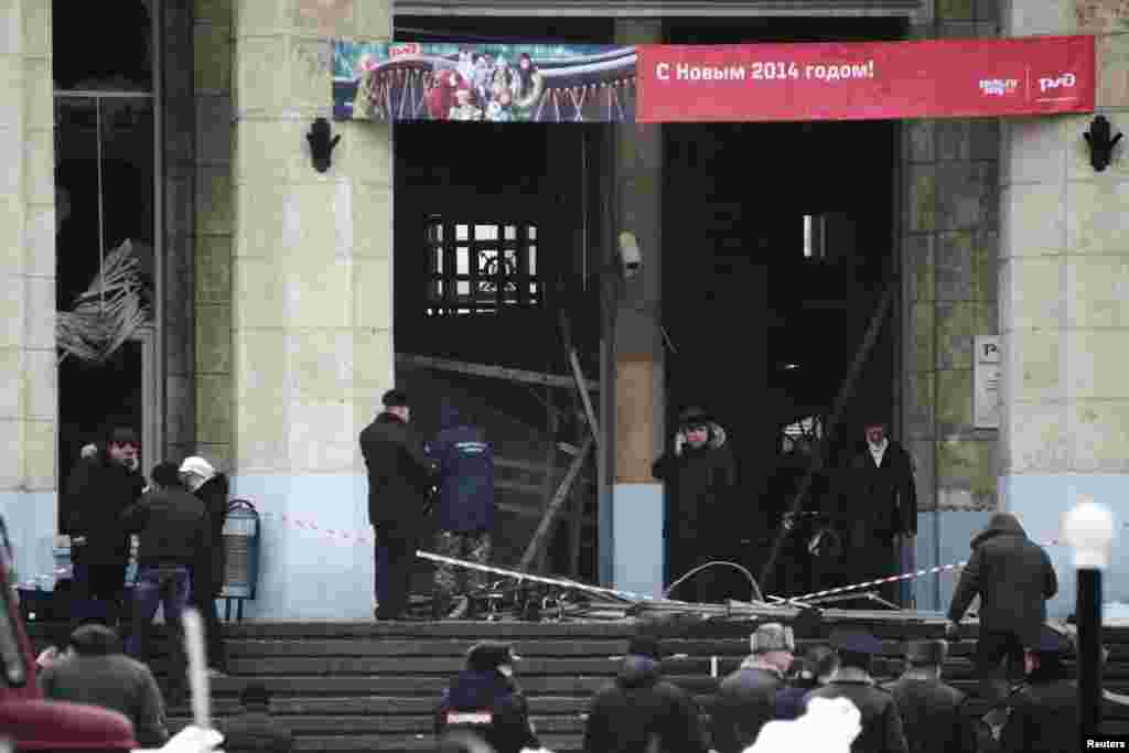 Investigators work at the site of an explosion near the entrance to a train station in Volgograd, Russia, Dec. 29, 2013. 