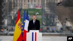 Spain's King Felipe VI delivers his speech during a ceremony to honor victims of terror attacks in Europe, on the 16th anniversary of Madrid attacks, at the Trocadero in Paris, Wednesday March 11, 2020. 