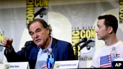 Director/writer Oliver Stone, left, and actor Joseph Gordon-Levitt discuss the film "Snowden" on the opening day of Comic-Con International in San Diego, California, July 21, 2016.