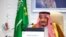 In this handout image from the Saudi Royal Palace, Saudi King Salman gives his opening remarks at a virtual G-20 summit hosted by Saudi Arabia and held via videoconference amid the COVID-19 pandemic, in Riyadh, Saudi Arabia, Nov. 21, 2020.