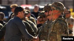 U.S. Defense Secretary Pete Hegseth meets with military personnel as he visits the border area in Sunland Park, New Mexico, Feb. 3, 2025. 