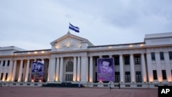 Pro-government posters cover the National Palace on Revolution Square in Managua, Nicaragua, Aug. 1, 2018. With control of the country's universities and other opposition bastions now firmly in government hands, Ortega, who has been in power since 2007, h