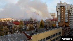 Smoke rises near a local railway administration headquarters damaged in shelling in the course of Russia-Ukraine conflict in Donetsk, Russian-controlled Ukraine, Nov. 7, 2022.