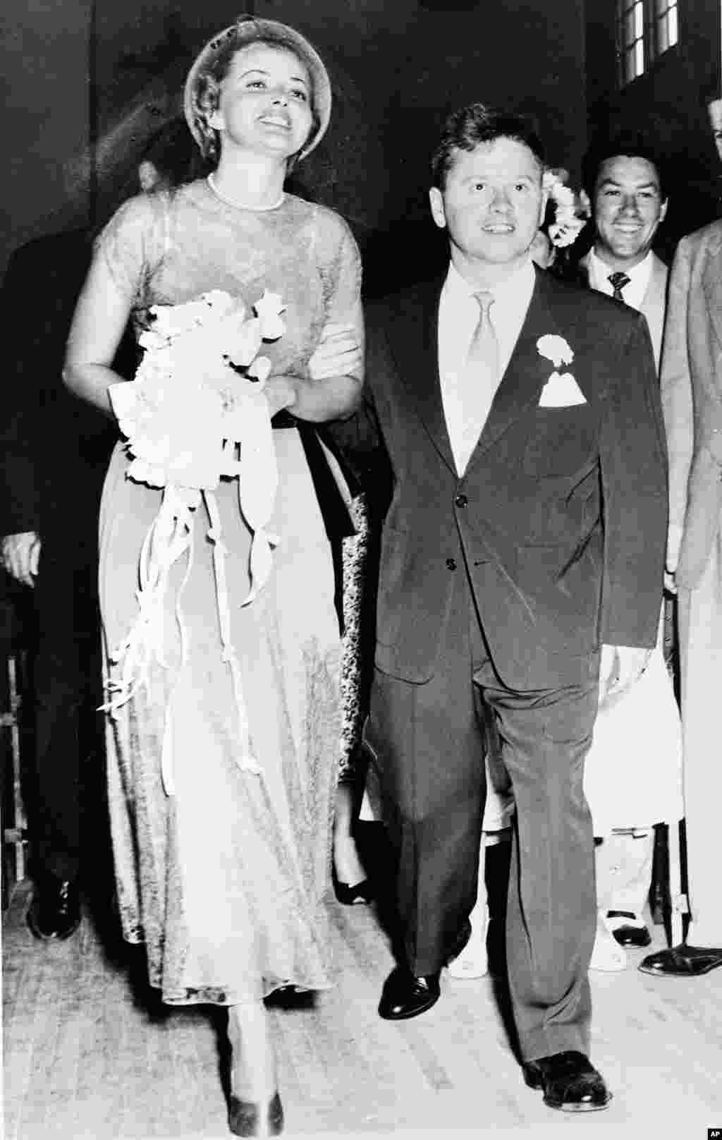 Actor Mickey Rooney and his bride, actress Martha Vickers, smile happily as they walk down the aisle of a church shortly after their wedding ceremony,&nbsp;in North Hollywood, California,&nbsp;June 3, 1949.