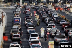 Cars queue up in multiple lines as they wait to be inspected by U.S. border patrol officers to enter from Mexico into the U.S., at the San Ysidro point of entry, in Tijuana, Mexico, April 1, 2019.