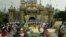 The stage is filled with Disney characters during the finale at Disneyland's 50th anniversary celebration ceremony, at the Disneyland theme park as "The Happiest Homecoming on Earth" begins in Anaheim, California May 5, 2005. Sleeping Beauty Castle (backg