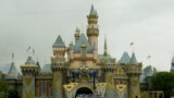 The stage is filled with Disney characters during the finale at Disneyland's 50th anniversary celebration ceremony, at the Disneyland theme park as "The Happiest Homecoming on Earth" begins in Anaheim, California May 5, 2005. Sleeping Beauty Castle (backg