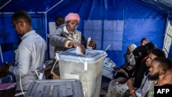 A man casts his ballot at a polling station during the 2024 Somaliland presidential election in Hargeisa, Nov. 13, 2024. 