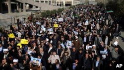 Iranian worshipers chant slogans during a rally against anti-government protesters after Friday prayers in Tehran, Iran, Jan. 5, 2018. 